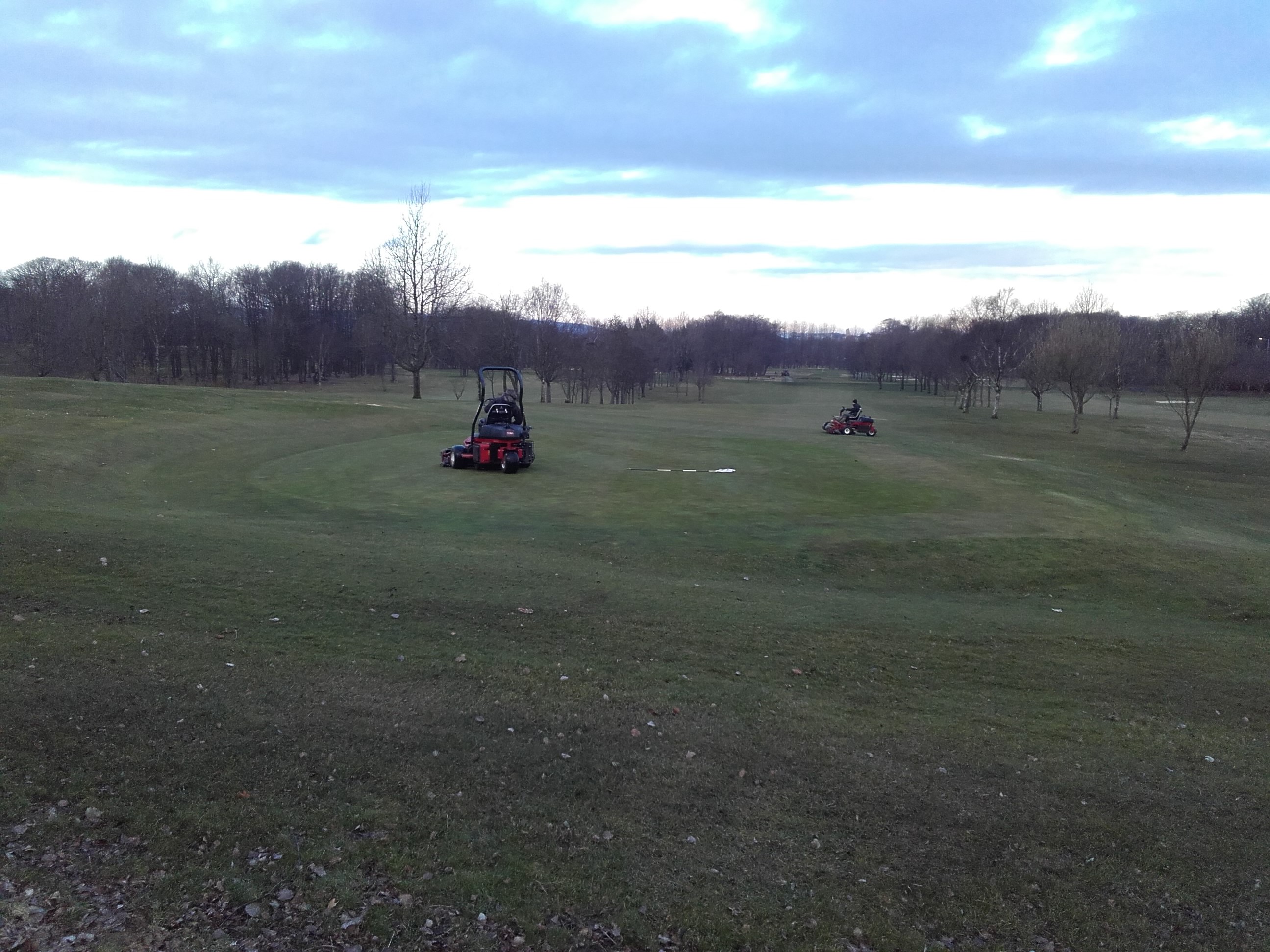 Greens on and being cut.